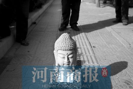 盒上写着人头里装佛头 专家称是工艺品(图)