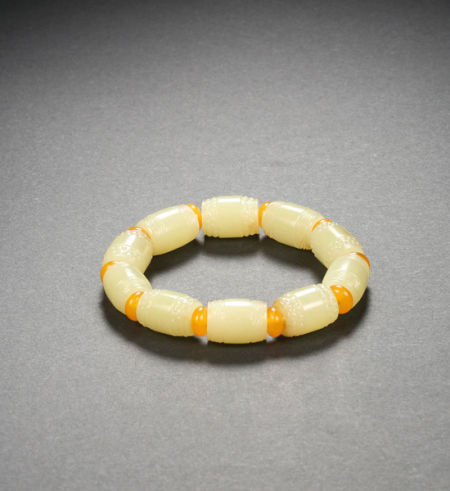 中国玉雕大师蒋喜作品  黄玉鼓形手串  成交价69400元