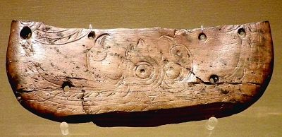 双鸟朝阳（象牙雕刻 公元前5000年 河姆渡遗址出土）